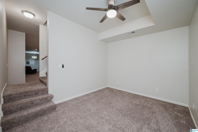 spare room with carpet flooring and ceiling fan