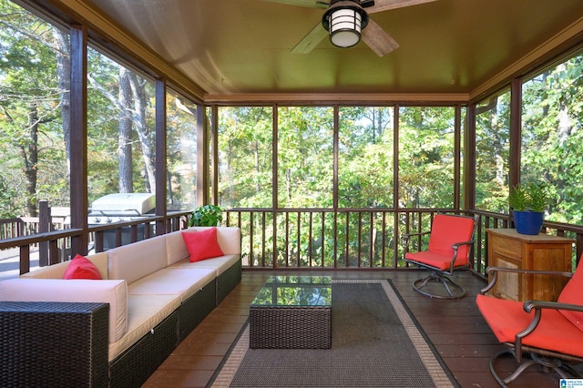 sunroom / solarium featuring ceiling fan and plenty of natural light