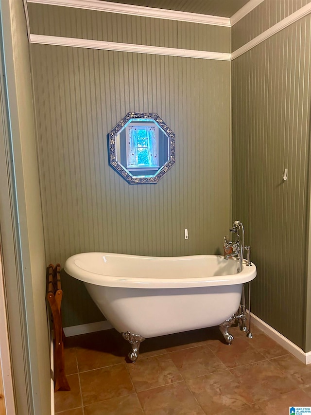 bathroom with tile patterned floors and a washtub