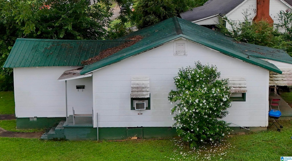 view of home's exterior featuring a yard