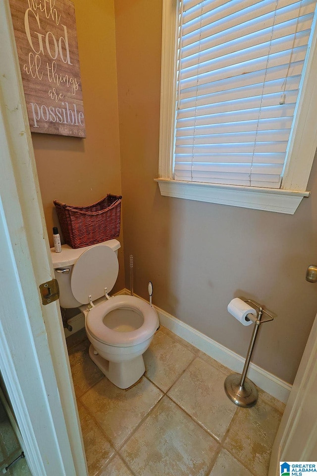 bathroom featuring toilet and tile patterned floors