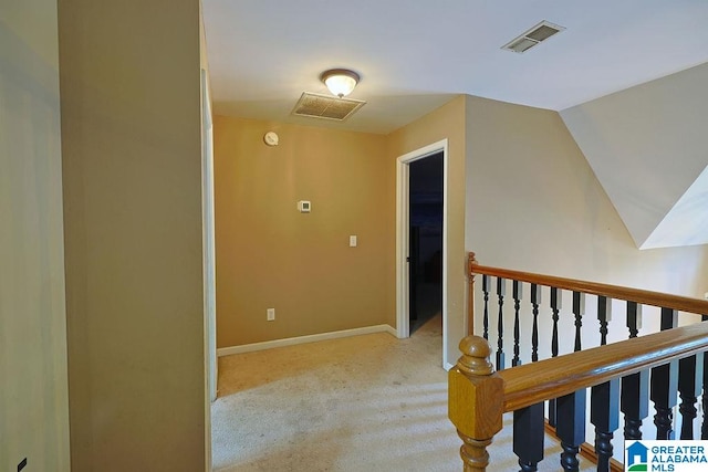 hallway with light colored carpet