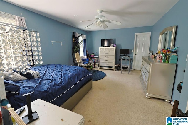 bedroom with light carpet and ceiling fan