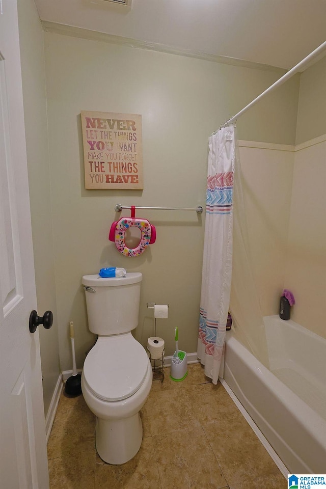 bathroom with toilet, tile patterned floors, and shower / bath combo