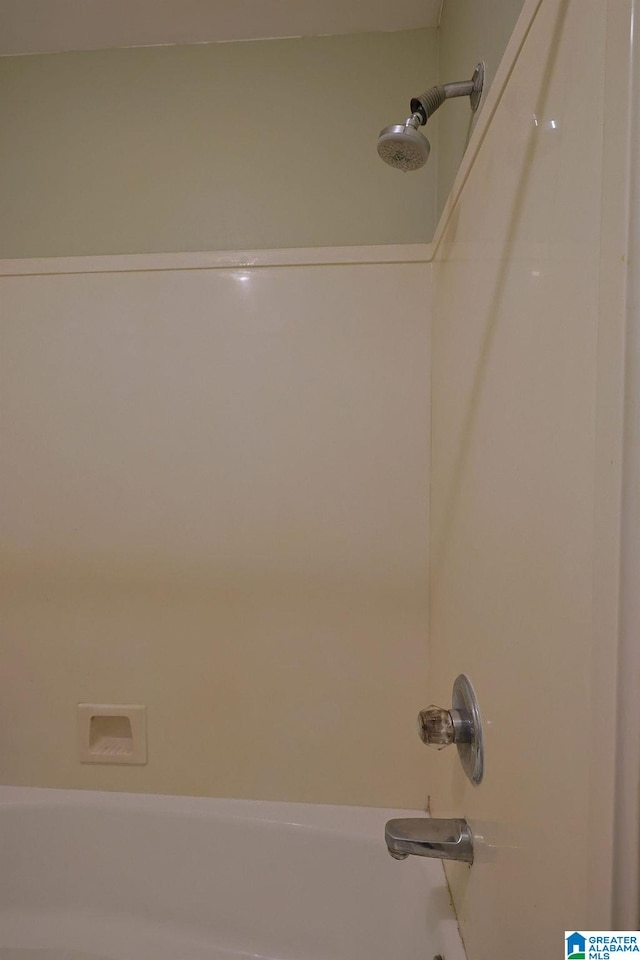 room details with washtub / shower combination