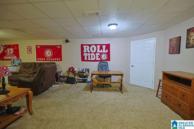 living room with carpet floors and a paneled ceiling