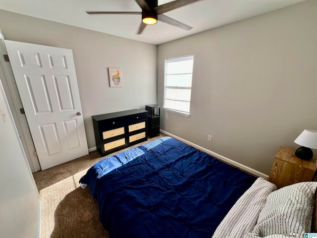 carpeted bedroom featuring ceiling fan