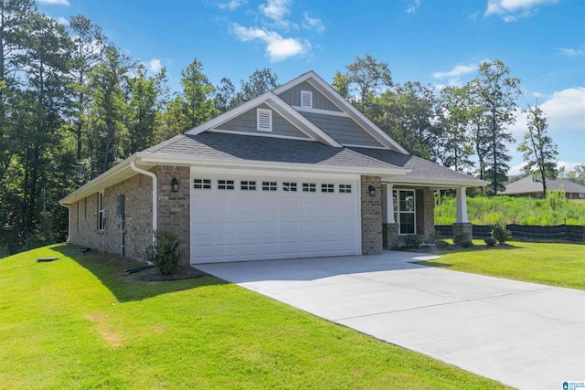 craftsman-style house featuring a front yard and a garage