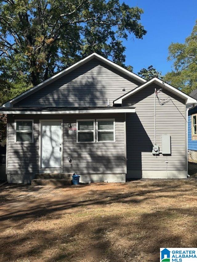8321 Division Ave, Birmingham, AL 35206 - back of house featuring a lawn and entry steps