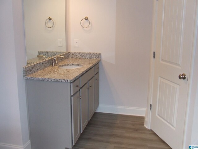 bathroom featuring vanity and hardwood / wood-style floors