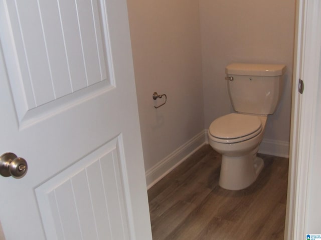 bathroom featuring toilet and hardwood / wood-style floors