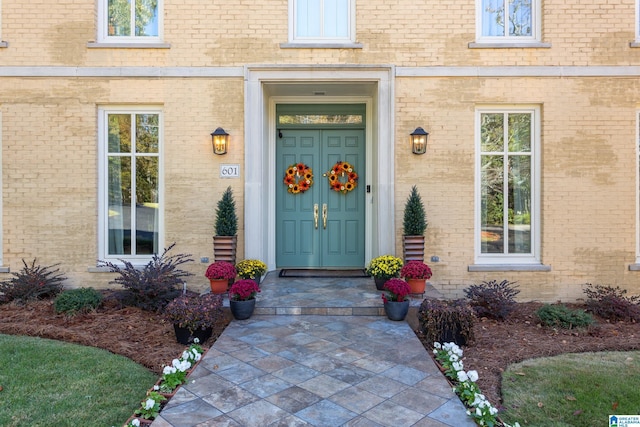 entrance to property with brick siding