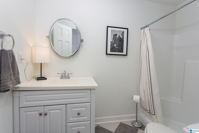 full bathroom with vanity, toilet, and shower / tub combo with curtain