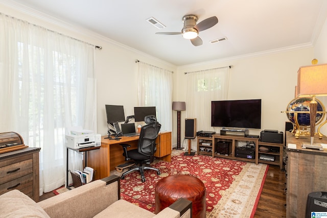 office space featuring ornamental molding, a ceiling fan, visible vents, and wood finished floors
