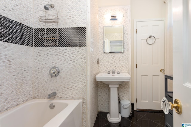 bathroom featuring shower / bathtub combination, tile patterned flooring, and tile walls