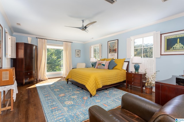 bedroom featuring dark wood-type flooring, ceiling fan, crown molding, and multiple windows