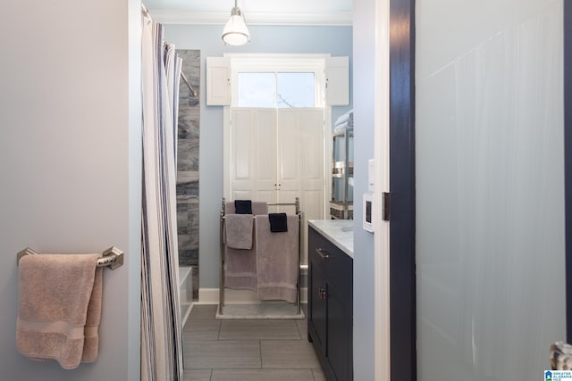 full bathroom featuring crown molding, shower / tub combo with curtain, and vanity