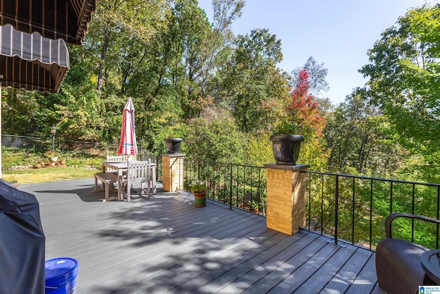 deck with outdoor dining area