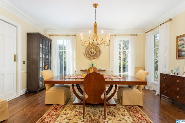 dining area with baseboards, wood finished floors, an inviting chandelier, and ornamental molding