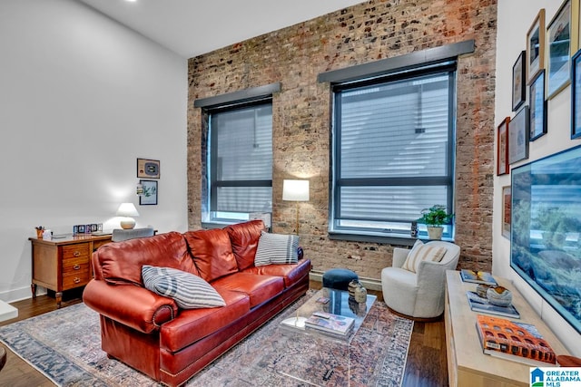 living room with wood-type flooring and a healthy amount of sunlight