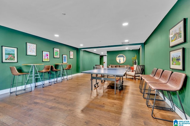 game room with light wood-type flooring