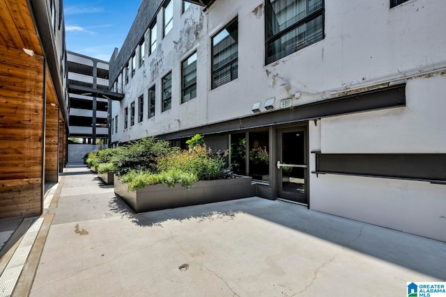 doorway to property featuring a patio