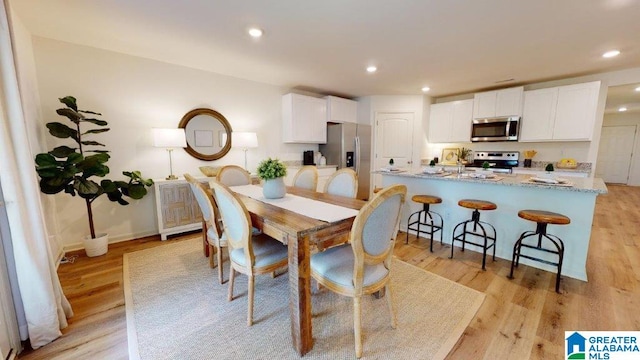 dining space featuring light hardwood / wood-style flooring