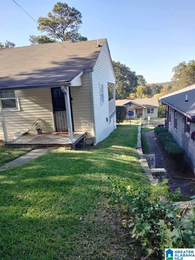 rear view of house with a lawn