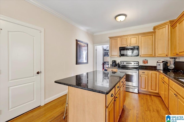 kitchen featuring stainless steel range with electric cooktop, a kitchen island, dark stone counters, light hardwood / wood-style floors, and crown molding