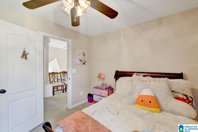 bedroom featuring light colored carpet and ceiling fan