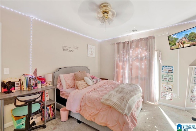 bedroom featuring light carpet and ceiling fan