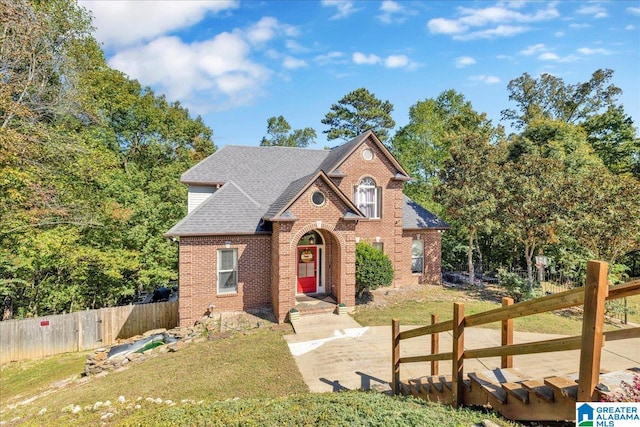 view of property with a front lawn