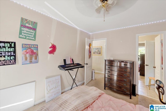 bedroom with ceiling fan and light carpet