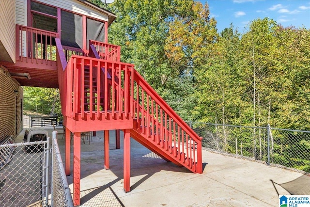 view of playground featuring a patio area