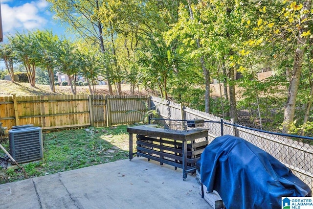 view of patio featuring cooling unit and a grill