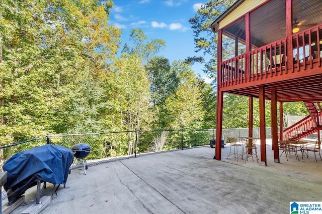 wooden terrace with a patio and grilling area