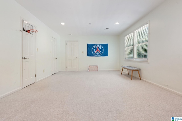 spare room with light colored carpet