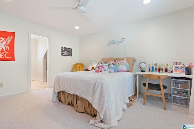 bedroom with ceiling fan and light colored carpet