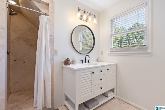 bathroom featuring vanity, a shower with shower curtain, and tile patterned floors