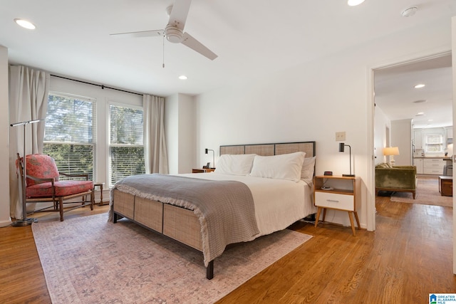 bedroom featuring hardwood / wood-style flooring and ceiling fan