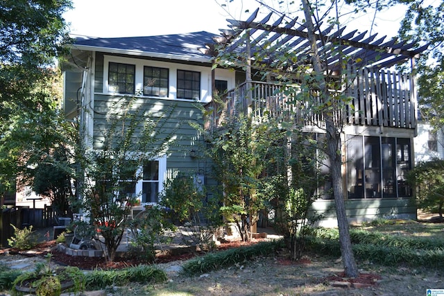 view of side of property featuring a pergola