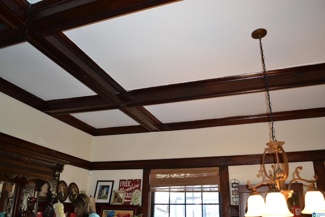 interior details with beamed ceiling, an inviting chandelier, and coffered ceiling