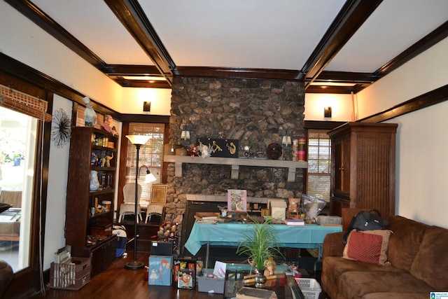 living room featuring hardwood / wood-style floors, crown molding, a fireplace, and beamed ceiling