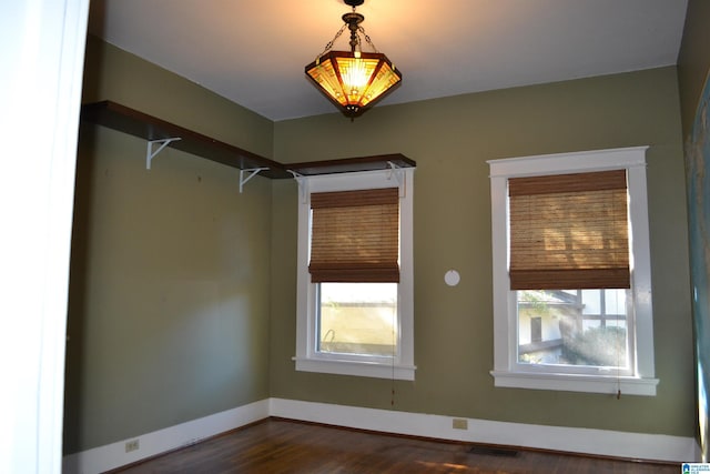2705 Caldwell Ave S, Birmingham, AL 35205 - spare room featuring dark wood-style flooring and baseboards