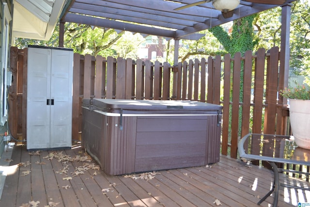 wooden terrace featuring a pergola and a hot tub