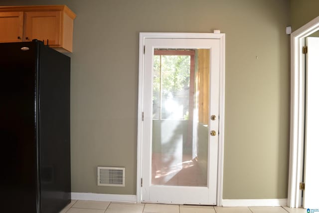 2705 Caldwell Ave S, Birmingham, AL 35205 - doorway to outside featuring light tile patterned flooring and baseboards