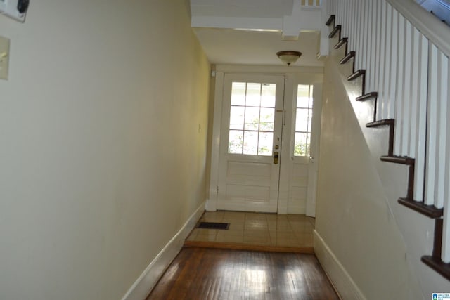 2705 Caldwell Ave S, Birmingham, AL 35205 - doorway featuring baseboards, wood-type flooring, and stairway