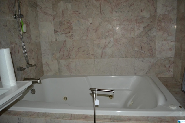 bathroom featuring tiled bath