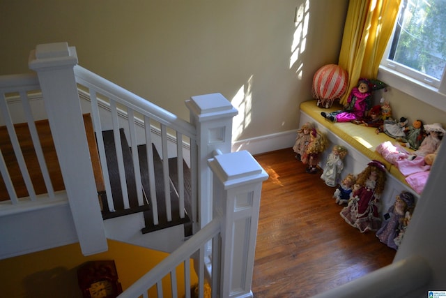 staircase featuring hardwood / wood-style floors