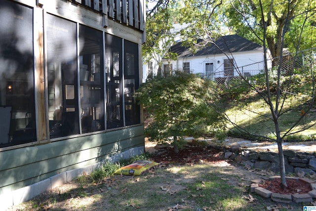 view of yard featuring a sunroom